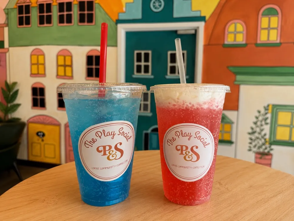 Two frozen signature drinks in The Play Social branded cups